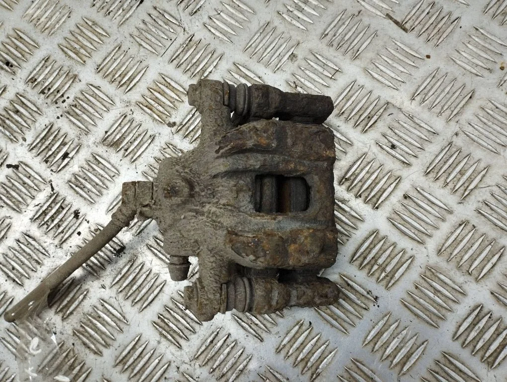 Rear brake caliper – left