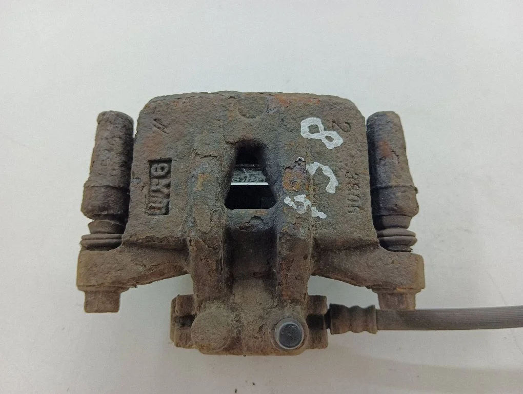 Rear brake caliper – left