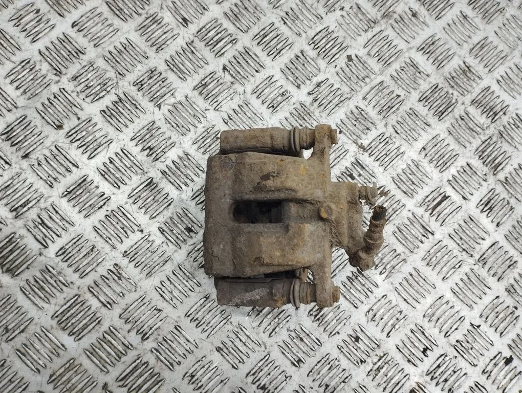 Rear brake caliper – left