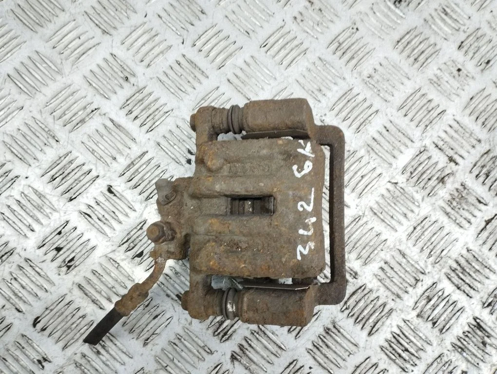 Rear brake caliper – left