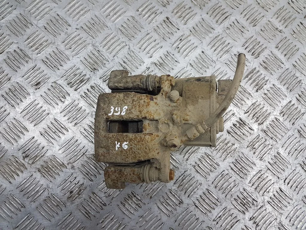 Rear brake caliper – left