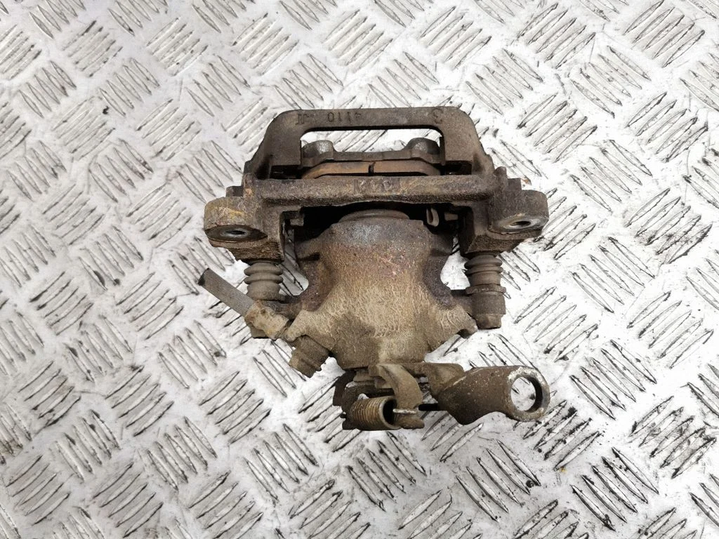 Rear brake caliper – left