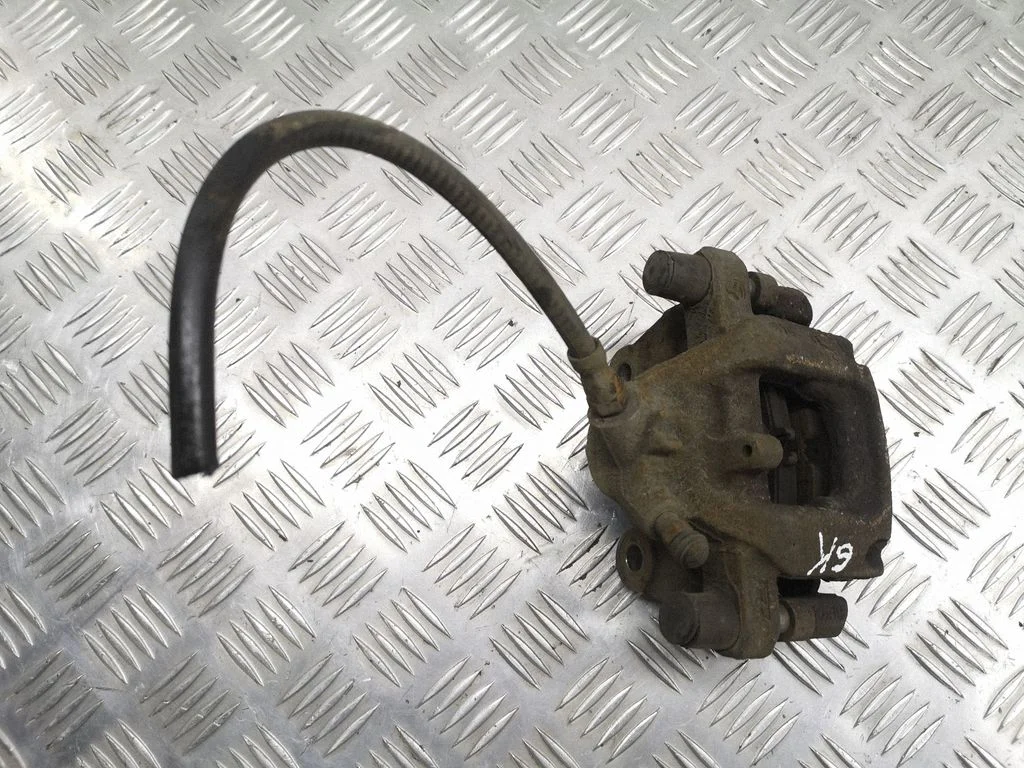 Rear brake caliper – left
