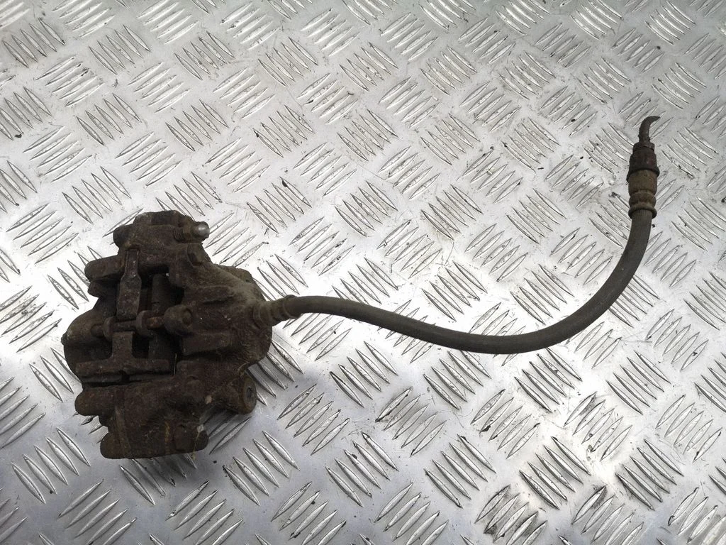 Rear brake caliper – left