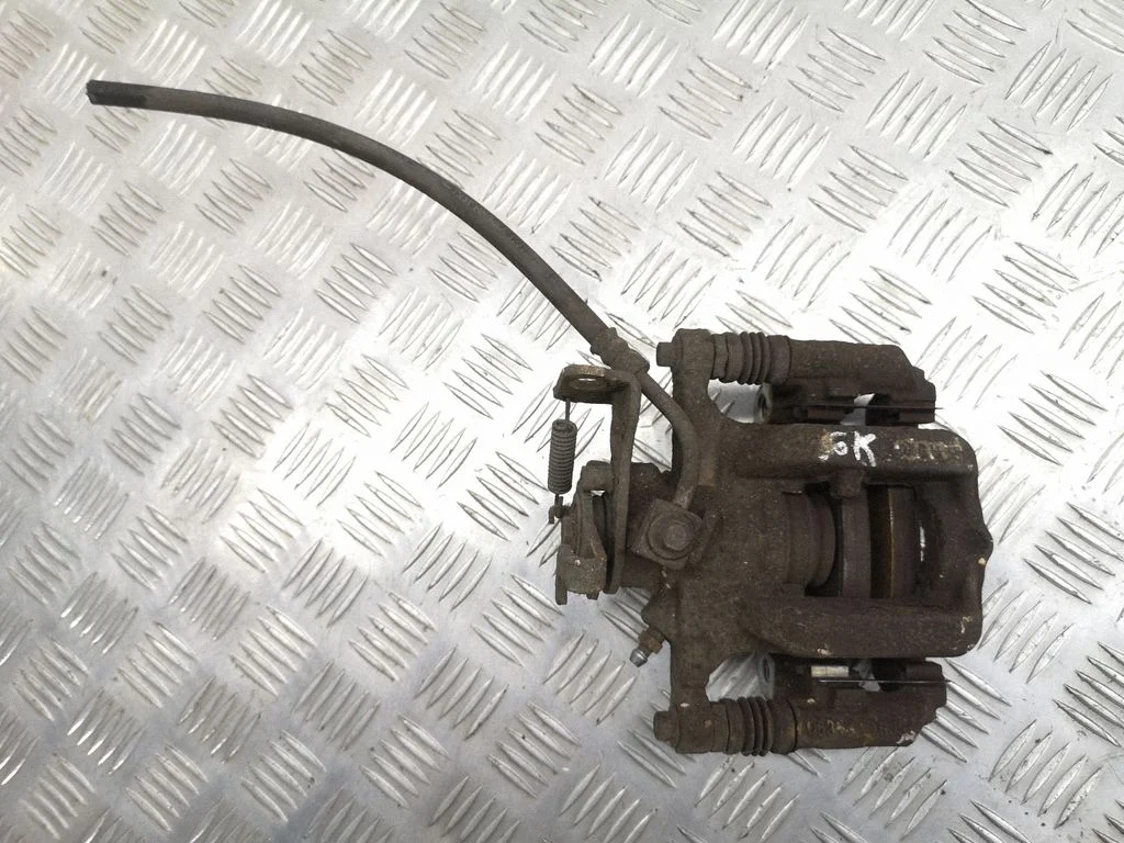 Rear brake caliper – left