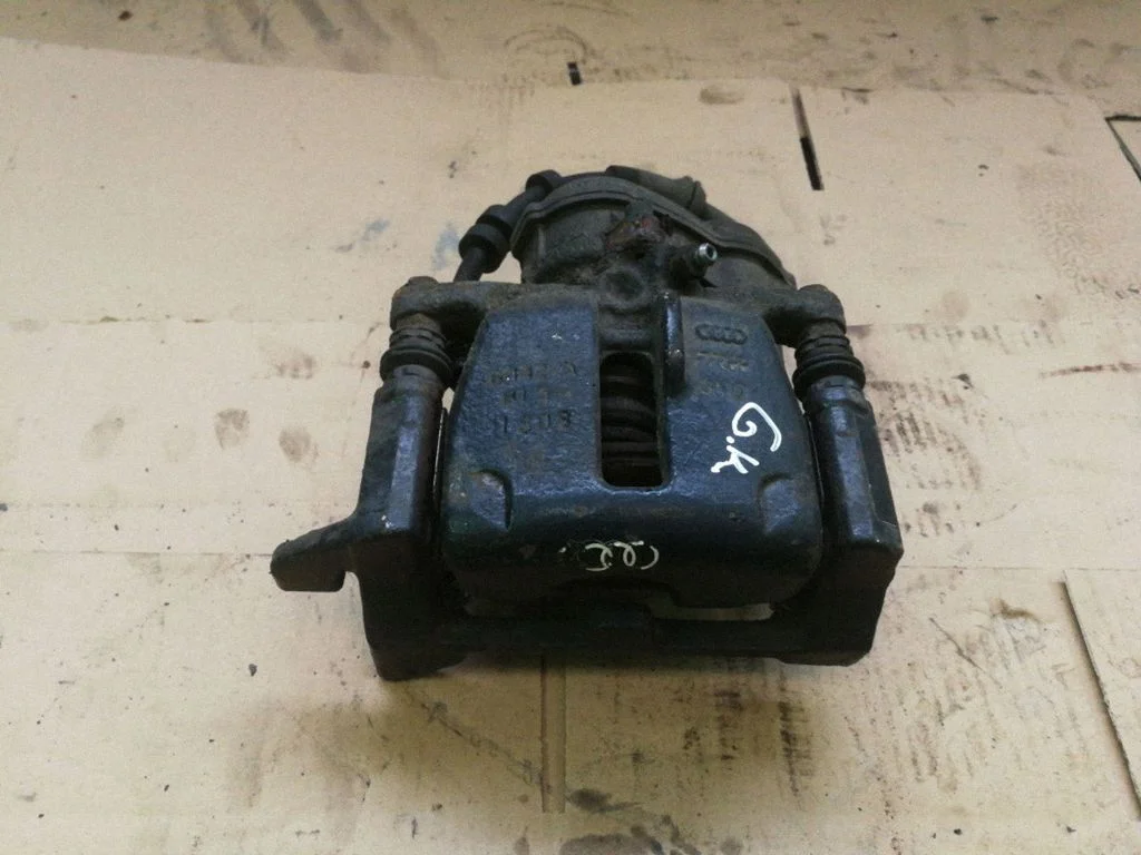 Rear brake caliper – left