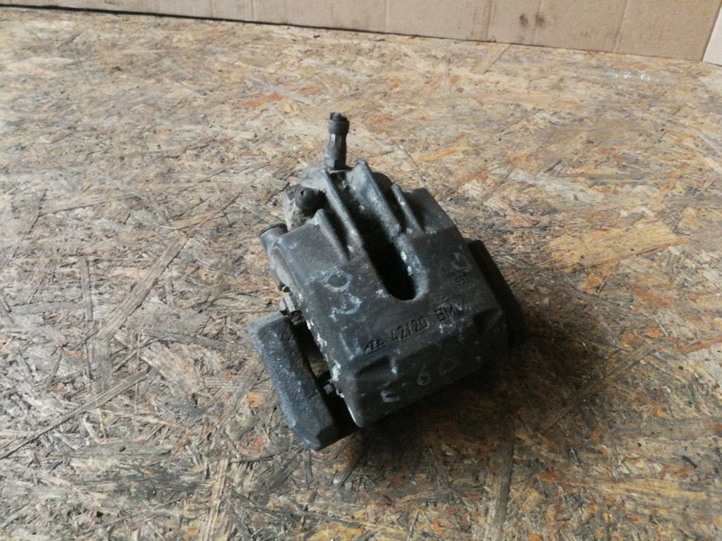 Rear brake caliper – left