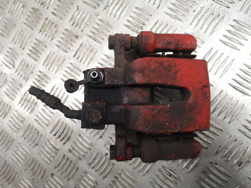 Rear brake caliper – left