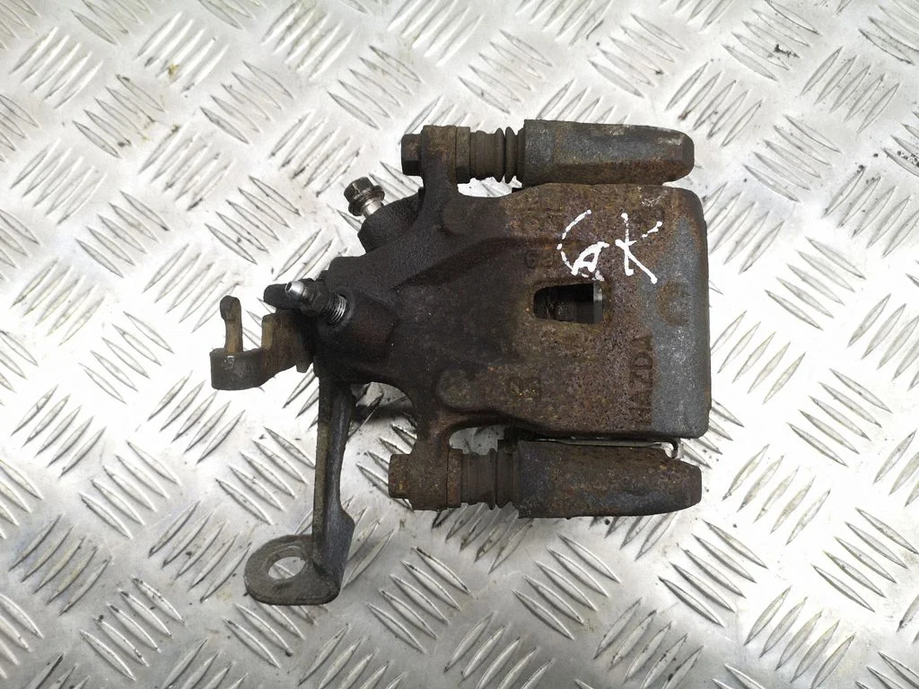Rear brake caliper – left