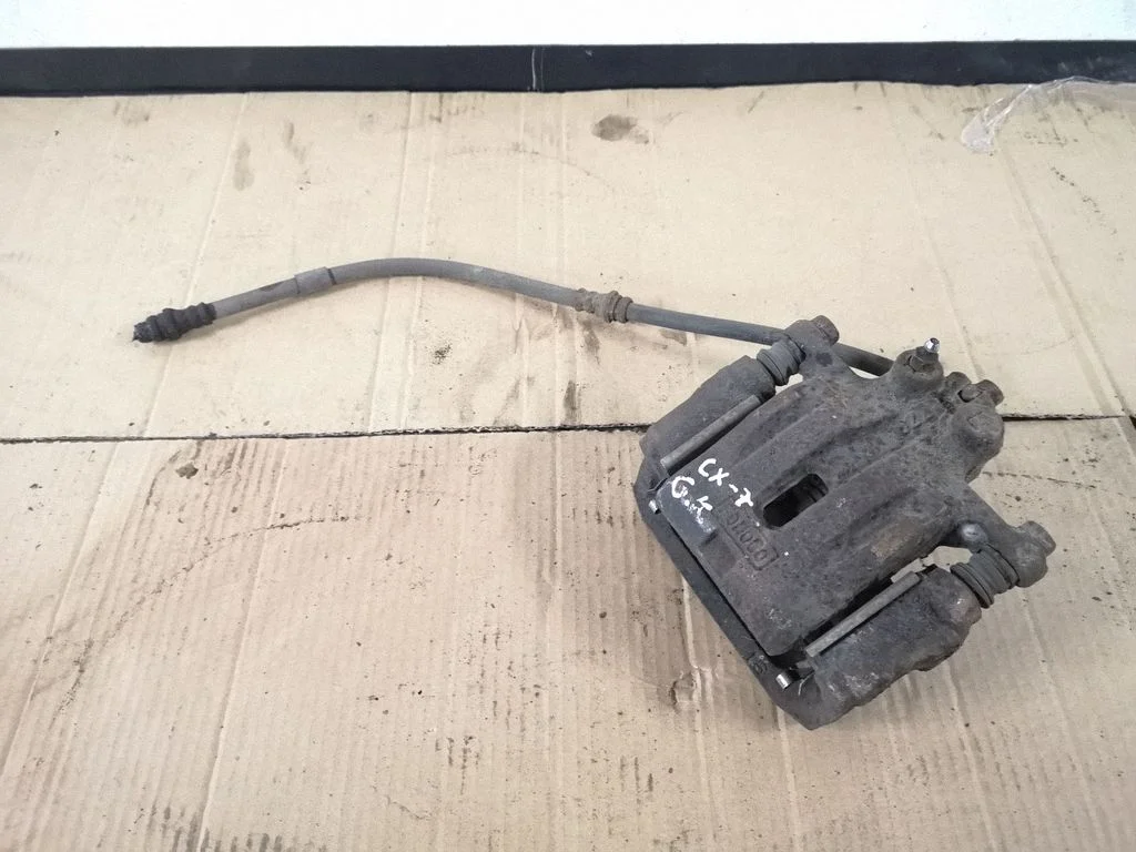 Rear brake caliper – left