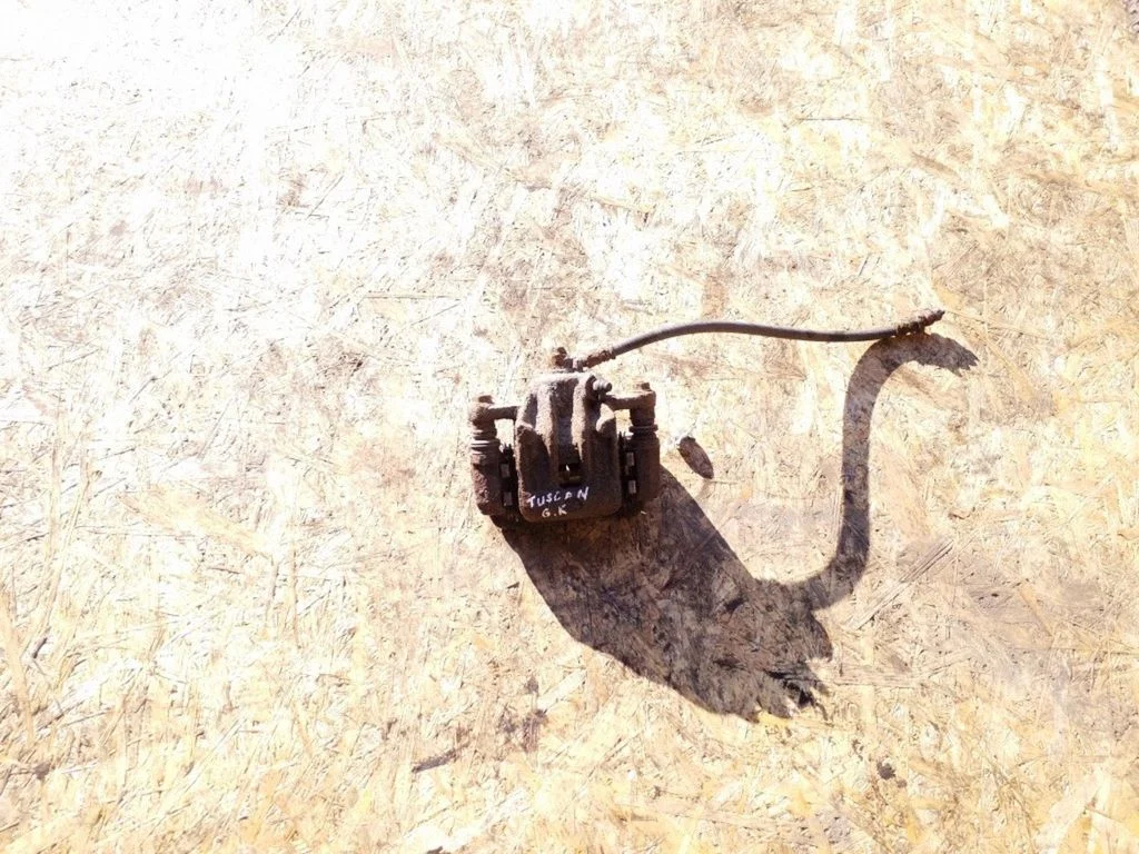 Rear brake caliper – left