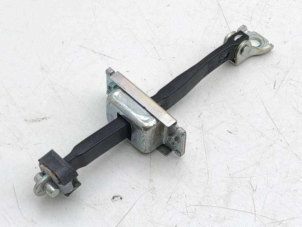 Front door check strap stopper – right
