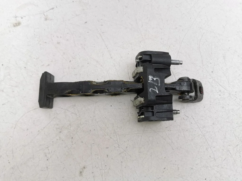 Front door check strap stopper – right