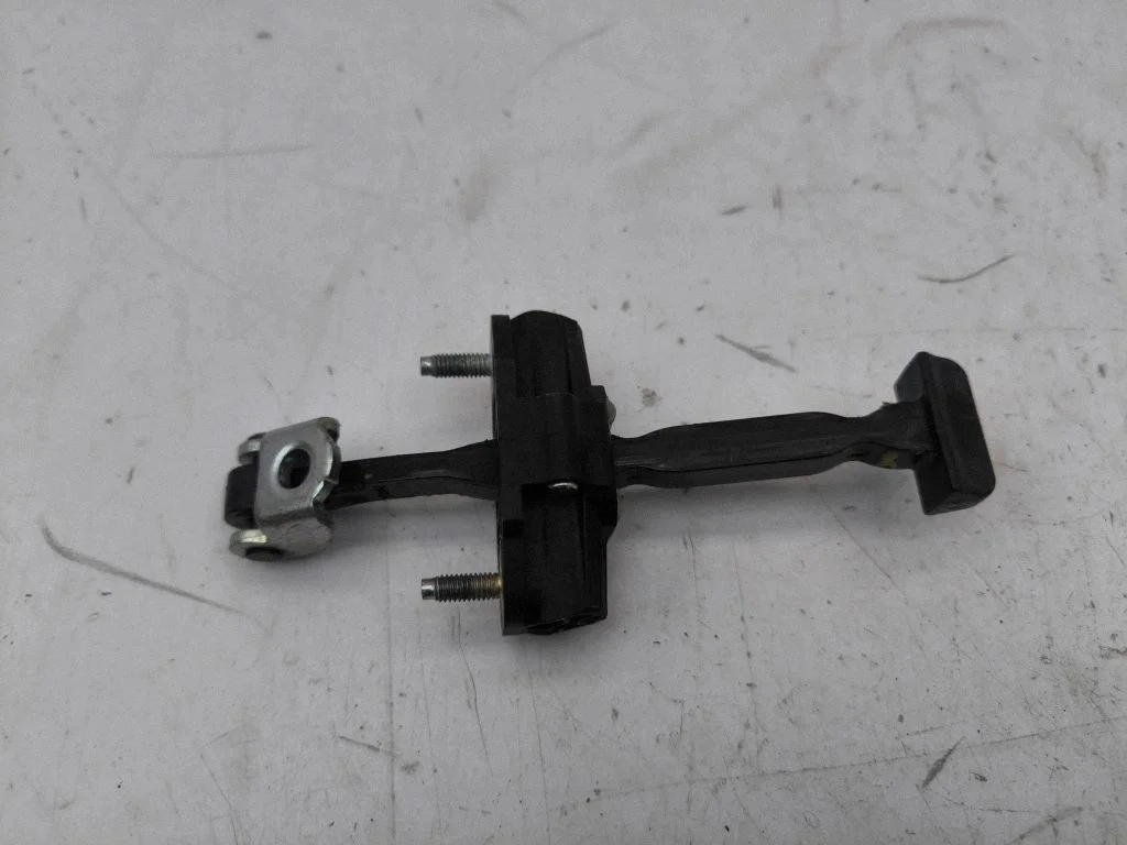 Front door check strap stopper U23500AC