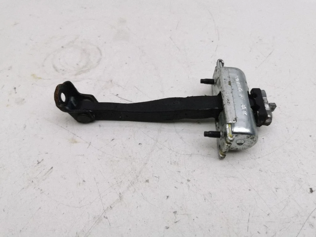 Front door check strap stopper – right