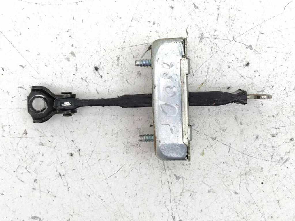 Front door check strap stopper – right