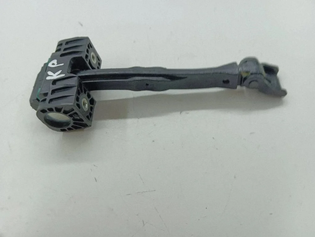 Front door check strap stopper – left