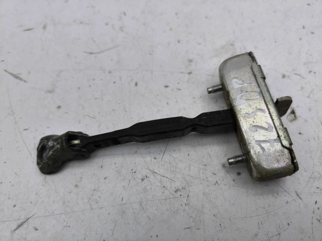 Front door check strap stopper – right