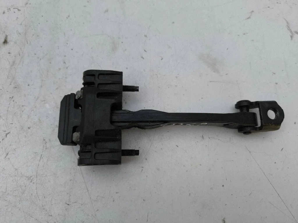 Front door check strap stopper – left