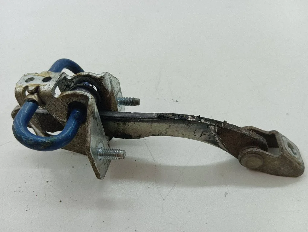 Front door check strap stopper – left