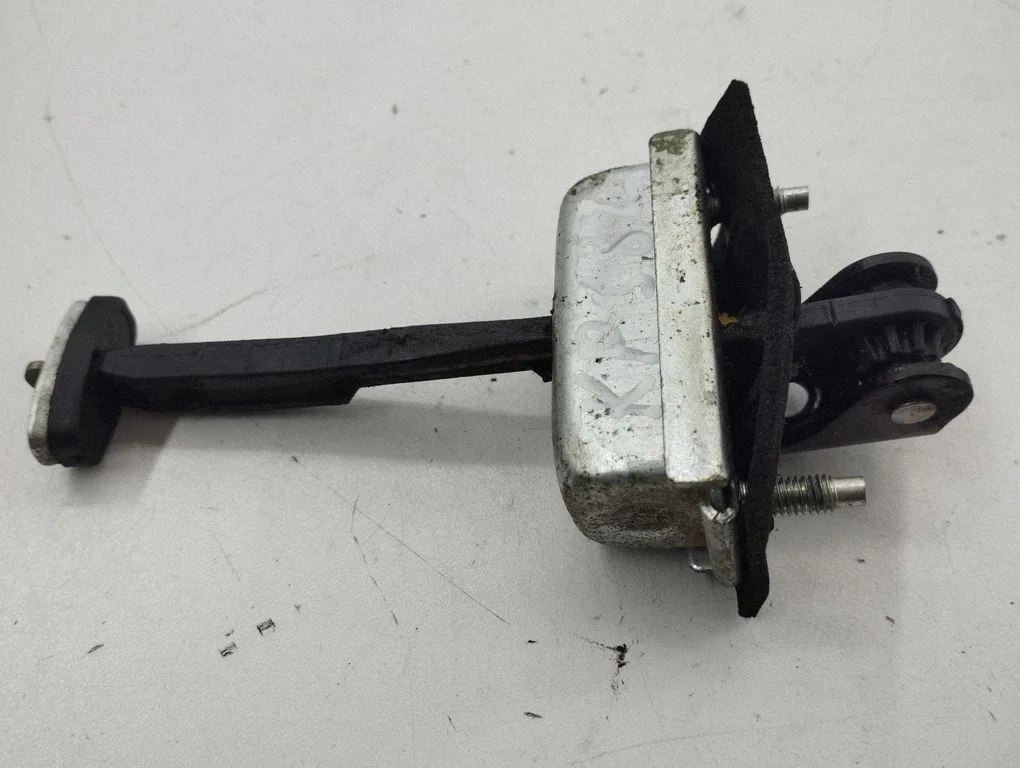 Front door check strap stopper – left