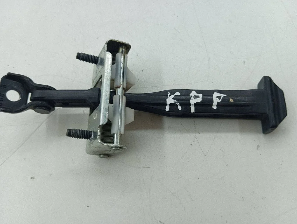 Front door check strap stopper – left