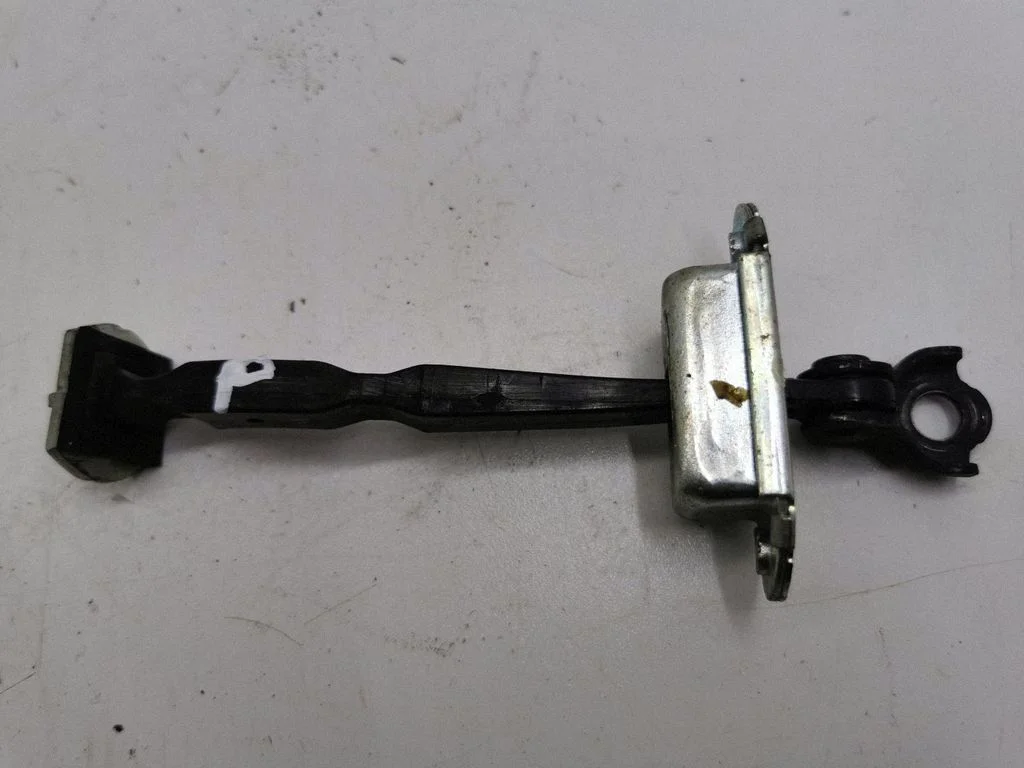 Front door check strap stopper – right