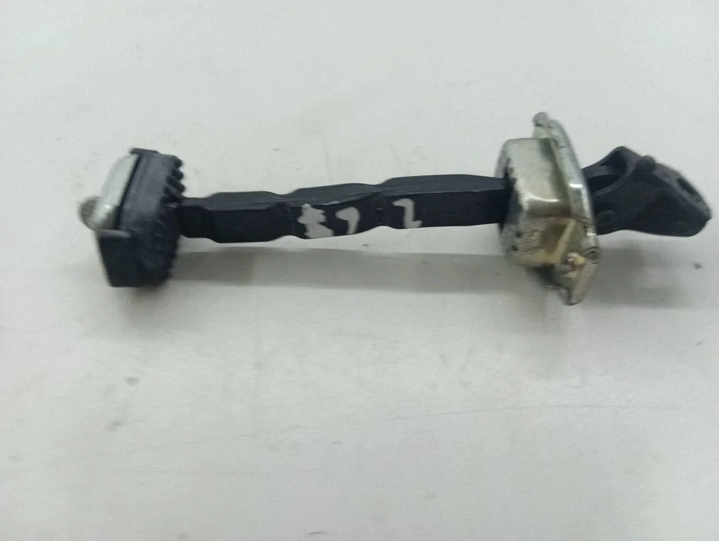 Front door check strap stopper – right