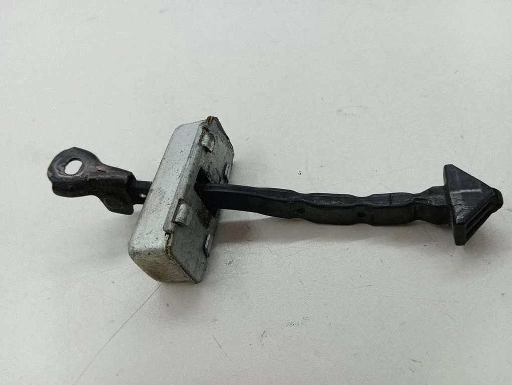 Front door check strap stopper – right