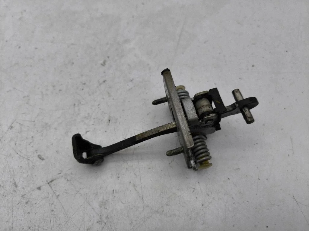 Front door check strap stopper – right