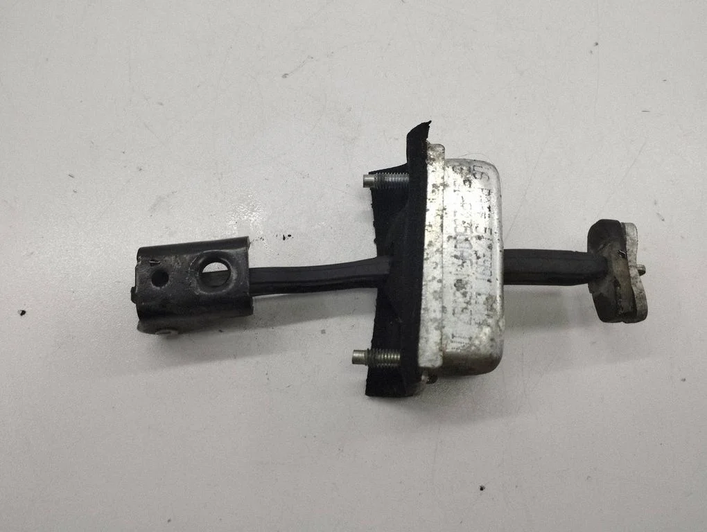 Front door check strap stopper – left
