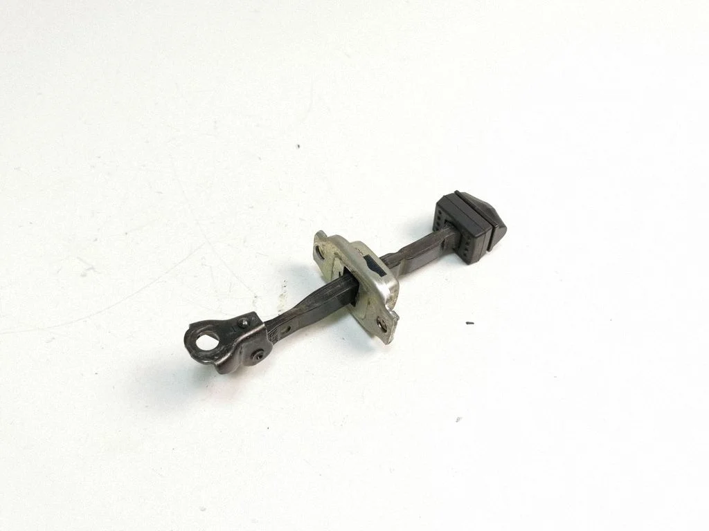 Front door check strap stopper – left