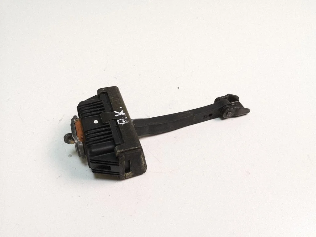 Front door check strap stopper 7033609