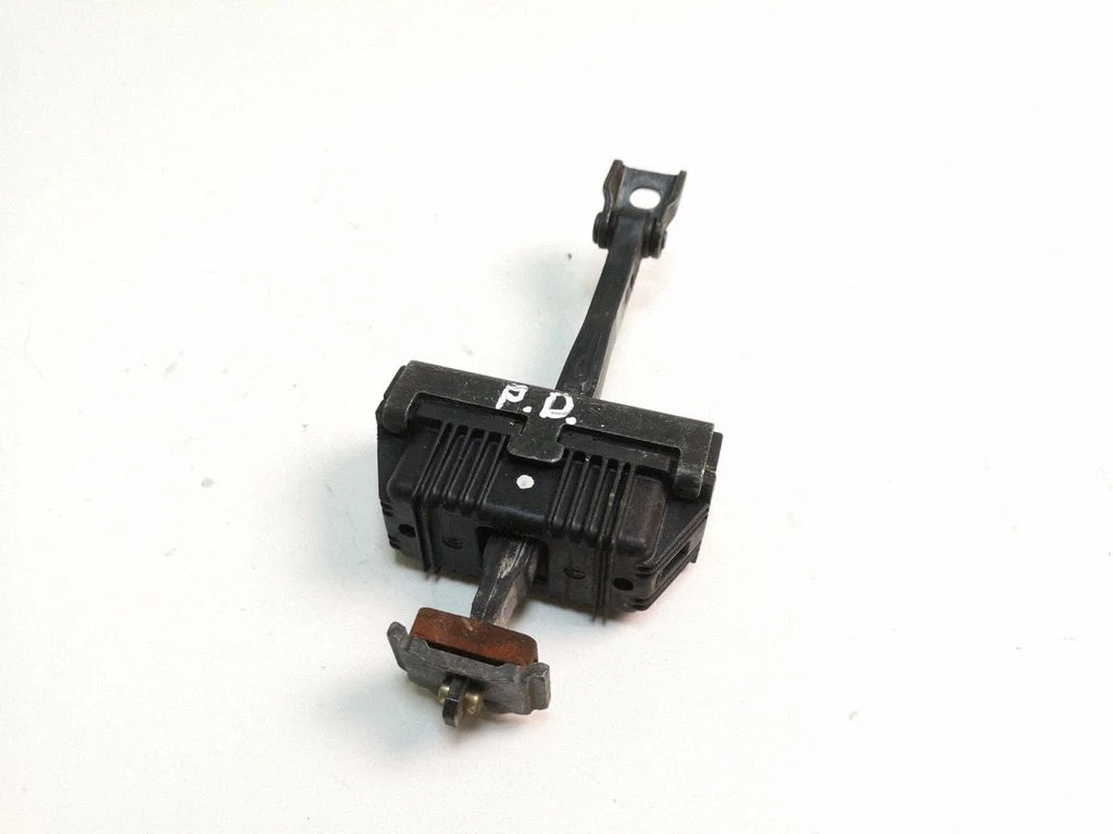 Front door check strap stopper 7033609