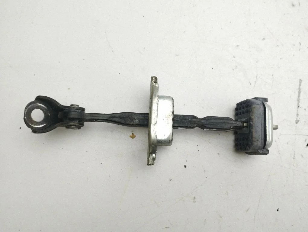 Front door check strap stopper – left