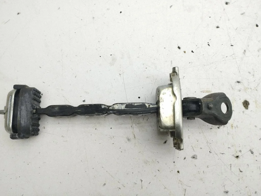 Front door check strap stopper – right