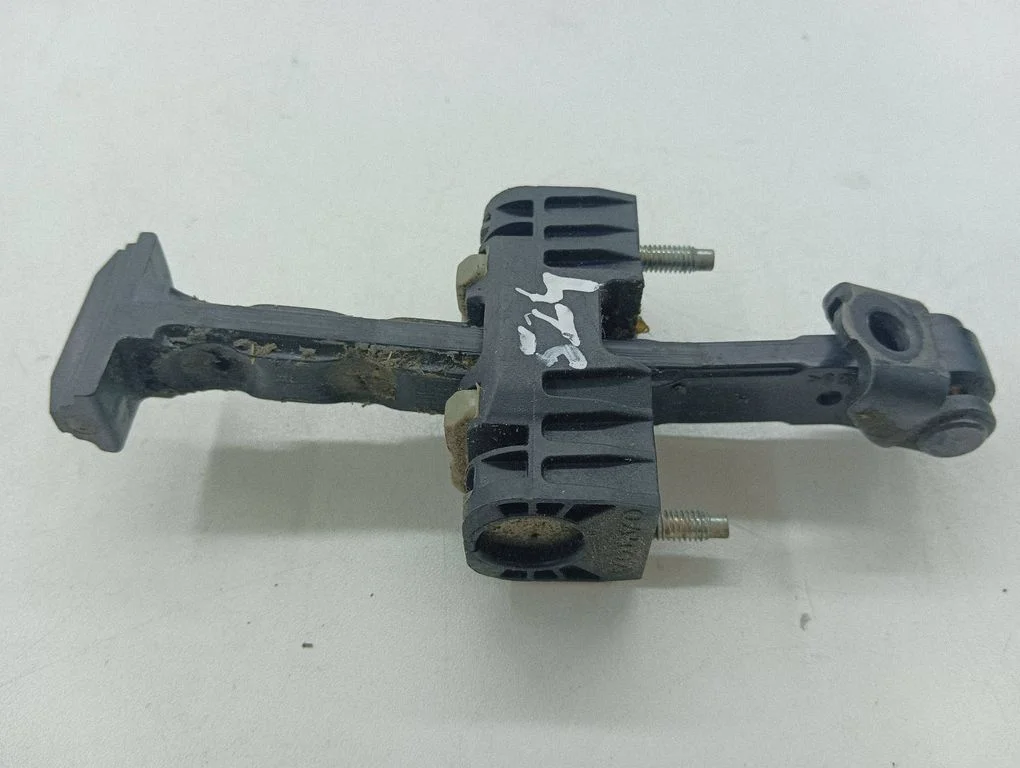 Front door check strap stopper – right