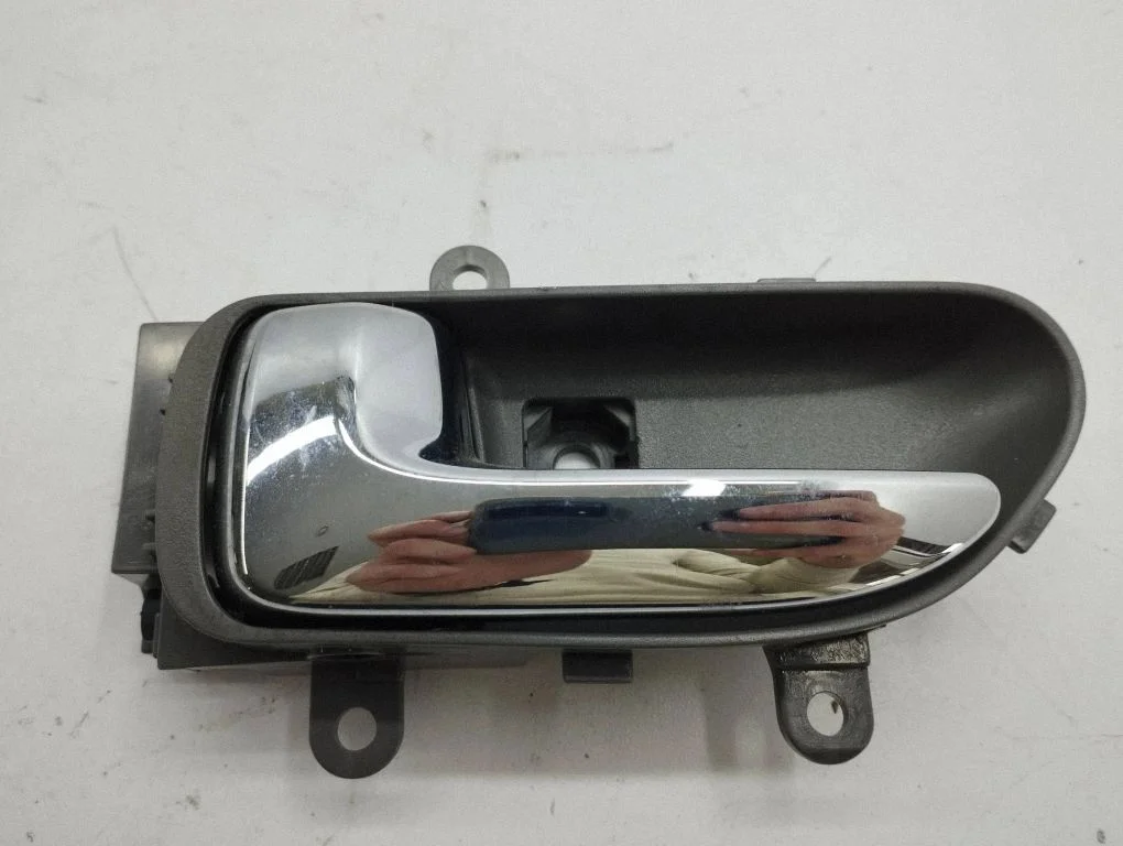 Front door interior handle – left