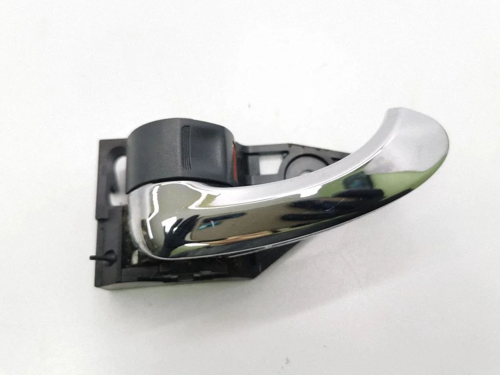 Front door interior handle – left