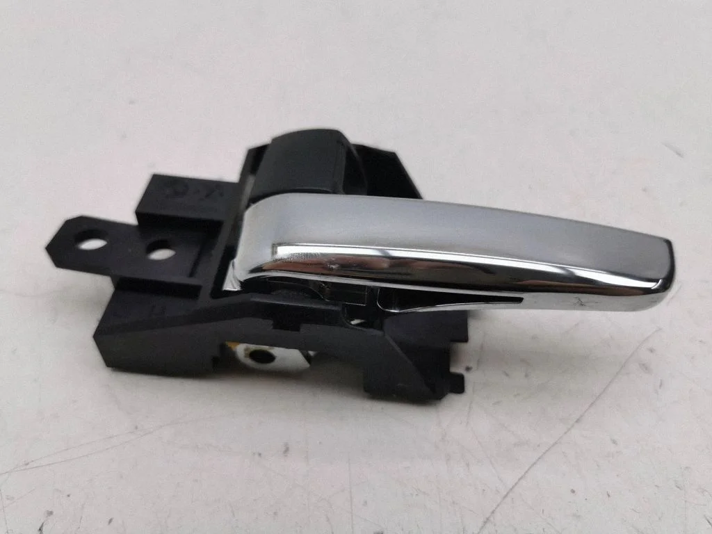 Front door interior handle – left