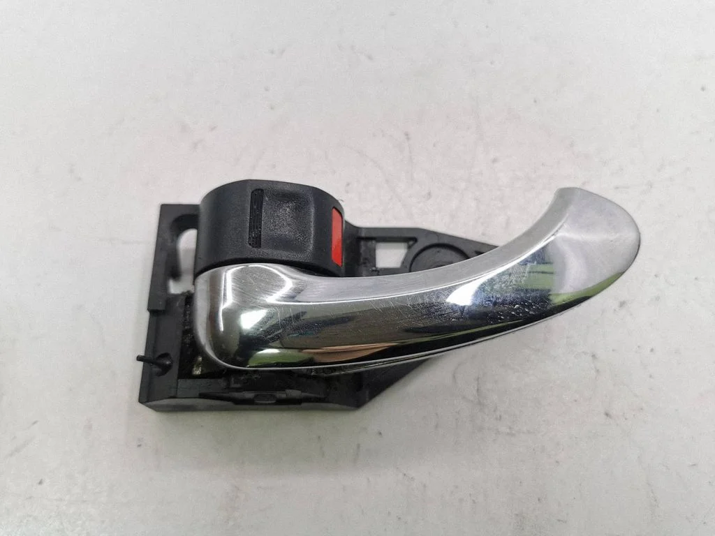 Front door interior handle – left