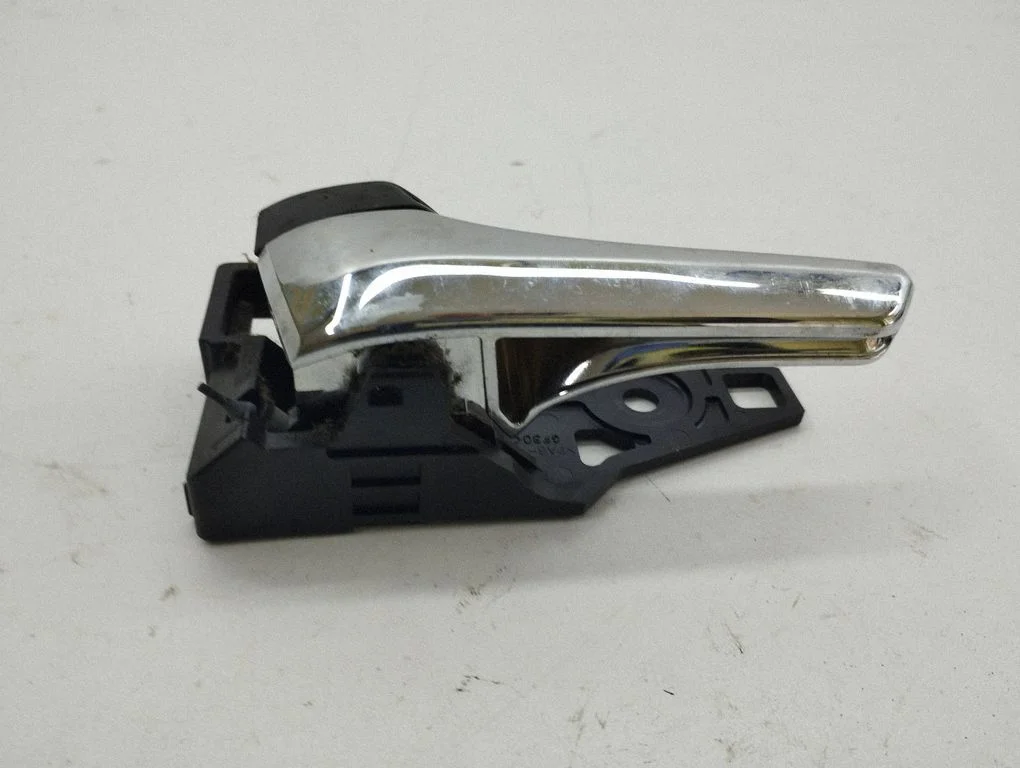 Front door interior handle – left