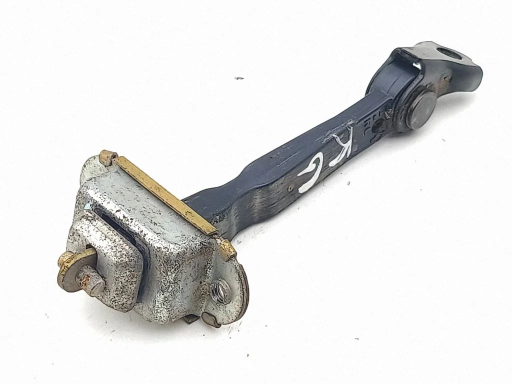 Rear door check strap stopper – left