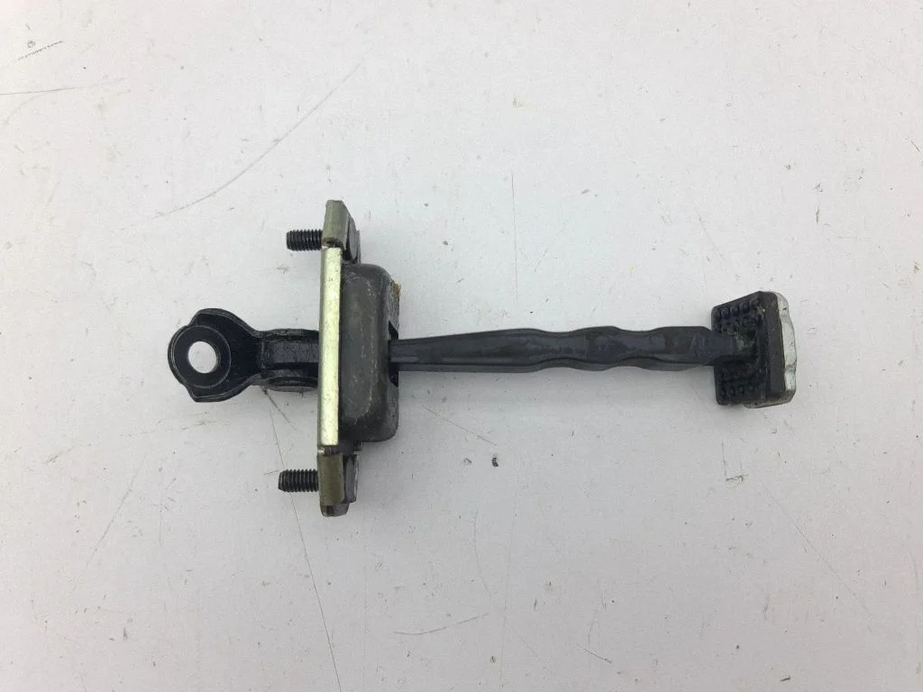 Rear door check strap stopper – left