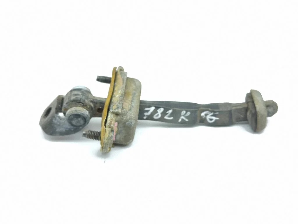 Rear door check strap stopper – left
