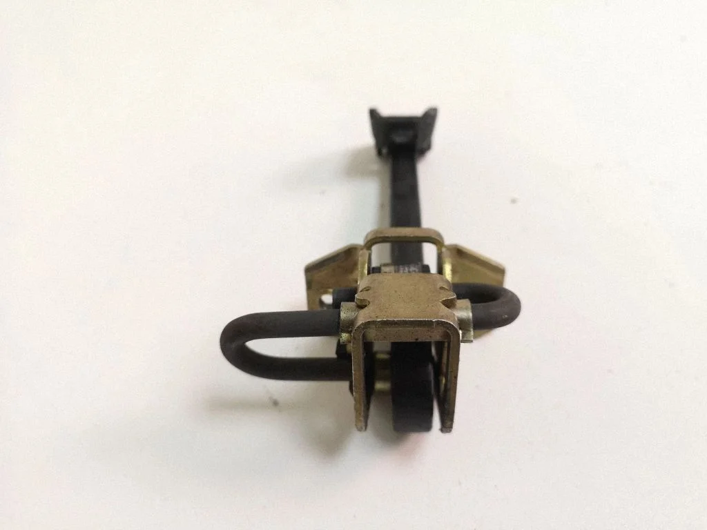 Rear door check strap stopper – left