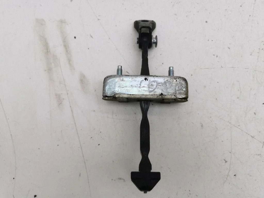 Rear door check strap stopper – right