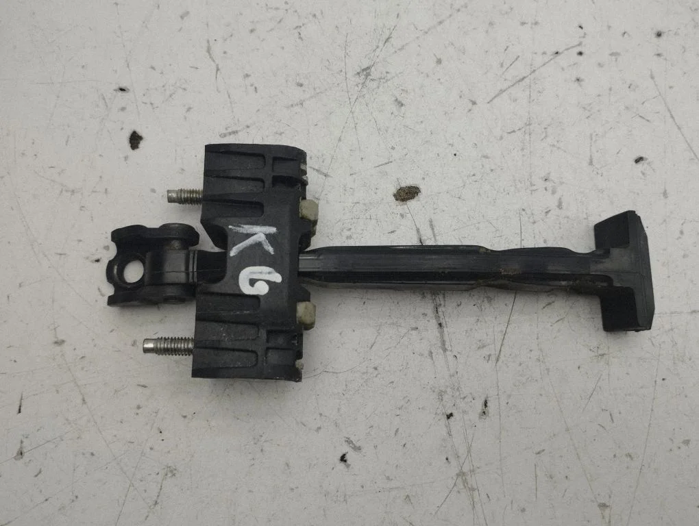 Rear door check strap stopper – left