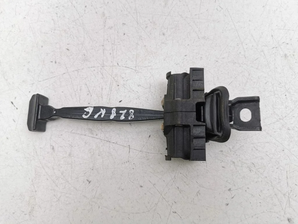 Rear door check strap stopper – left