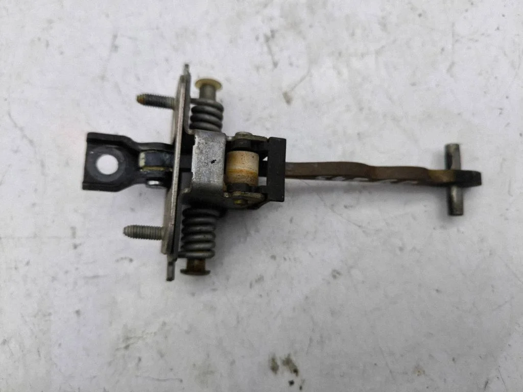 Rear door check strap stopper – right